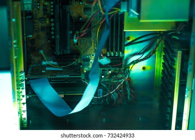Close up view inside open midi tower computer case with red and blue lighting effects