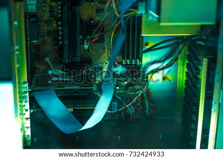 Close up view inside open midi tower computer case with red and blue lighting effects