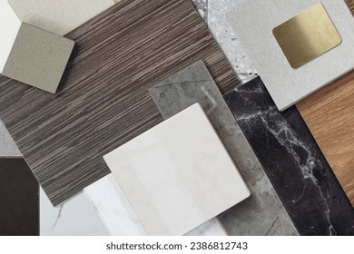 close up view of interior materials sample including black and gery marble stones, wooden vinyl flooring tiles, quartz, ceramic tiles, walnut veneer, terrazzo stone, stainless. mood and tone board.