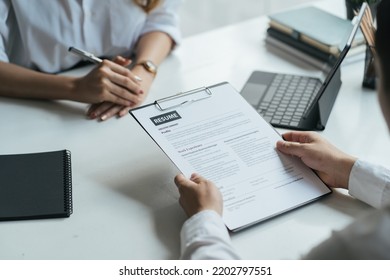 Close Up View Of Job Interview In Office, Focus On Resume Writing Tips, Employer Reviewing Good Cv Of Prepared Skilled Applicant, Recruiter Considering Application, Hr Manager Making Hiring Decision