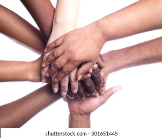 A Close Up View Of A Large Group Of People Of Mixed Races And Genders Holding Hands In A Supportive Manner.