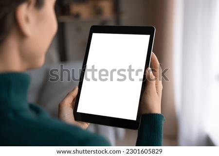Close up view of Latino woman hold pad device with white mockup screen talk speak online in video call on gadget. Hispanic female use tablet browse wireless internet. Mock up, technology concept.