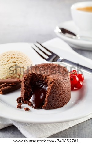 Close up view of lava cake filled with chocolate served on plate