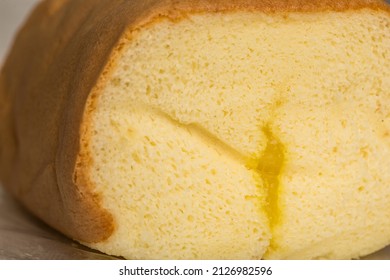 Close Up View Of Lemon Jelly Inside The Lemon Roll Cake From Chinese Bakery Store.