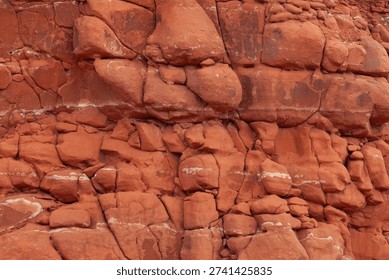Close up view of lumpy fractured red rock surface