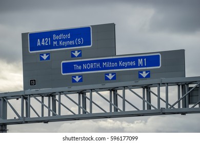 Close Up View Of M1 Highway Signs Against Cloudy Sky In England