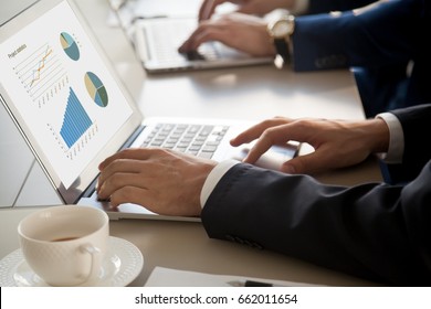 Close up view of male hands using pc laptop, businessman working at meeting, preparing presentation, analyzing statistics on screen, showing charts and rising graphs, project management concept