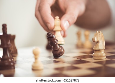 Close Up View Of Man Playing Wooden Chess Alone