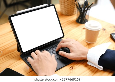 Close up view of man using tablet blank white screen for text message or information..