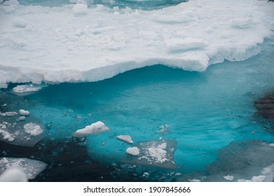 Close View Of Melting Arctic Sea Ice With Turquoise Blue Ice Form Under Water