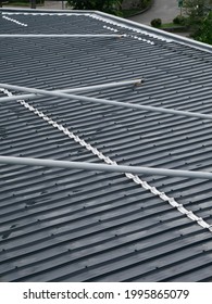 Close Up View Of Metal Sheet Roof With Tension Rod