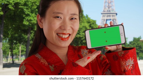 Close View Of Millennial Woman Holding Phone With Greenscreen In Paris France