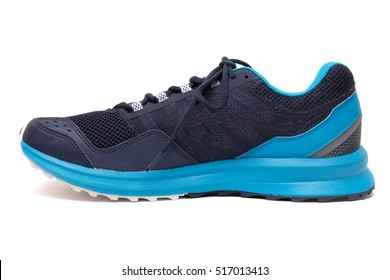 Close Up View Of A Modern Blue Man Sports Tennis Shoes Isolated On A White Background.