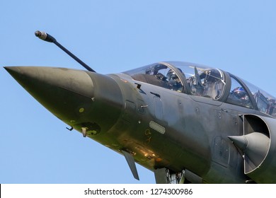 Close Up View Of A Modern Military Armed Fighter Jet Plane Taking Off.