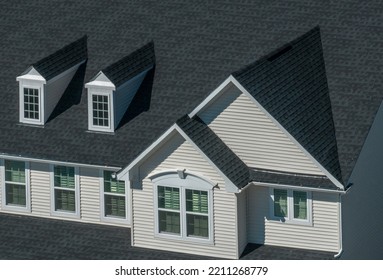 Close Up View Of Modern Single Family House Details With Horizontal Vinyl Siding, Accented Window Frame, Double Gable, Two Pedimented Dormer Windows On The Roof