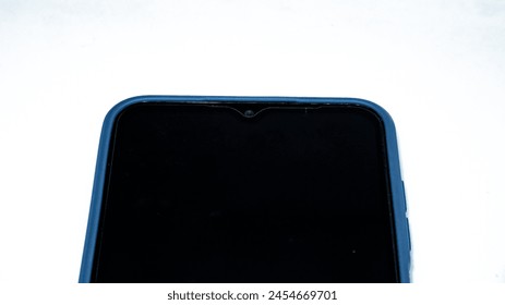 Close up view of a modern touch screen smartphone featuring a sleek blue rubber casing. This smartphone offers a glimpse into the world of cutting-edge technology. Isolated on a white background.
