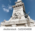Close up view of the Monument to the Restorers with cloudy blue sky on the background in Lisbon, Portugal. The monument memorializes the victory of the Portuguese Restoration War.