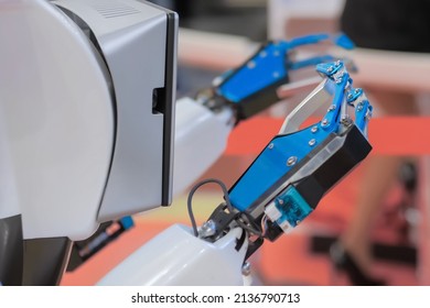 Close Up View Of Moving Futuristic Robotic Clamp Arms Of White Robot. Future, Engineering, Cybernetic, Science And Robotic Concept