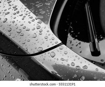 Close up view of a new german manufactured sports car as see after a heavy rain shower.