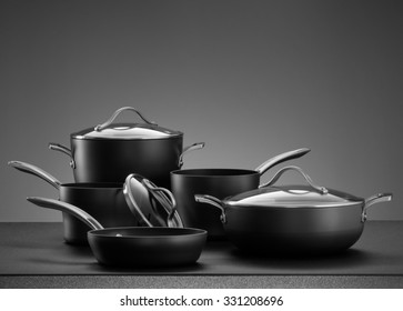close up view of nice cookware set on grey color back