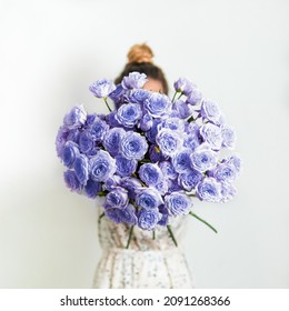 Close up view of nice delicate purple bouquet or bunch with violet roses. Demonstrating color of 2022 year very peri in floristic and wedding. Live bouquet of violet roses for valentines day - Shutterstock ID 2091268366