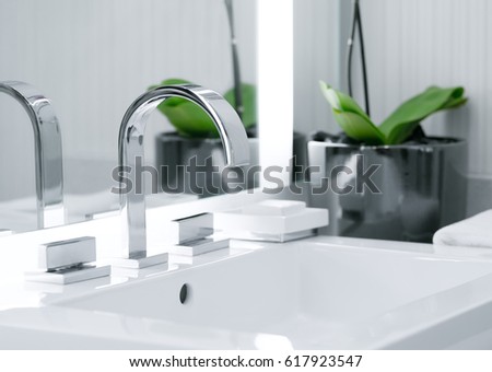close up view of nice metal faucet in modern bathroom