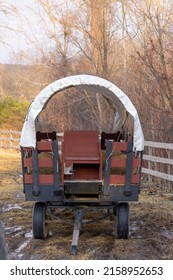 Close Up View Of Old Covered Wagon In The Farm