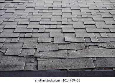 Close Up View On Asphalt Roofing Shingles Roof Damage Covered With Frost