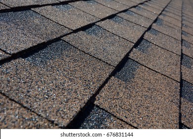 Close up view on asphalt roofing shingles background. 