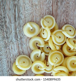Close up view on authentic Italian pasta shapes on wooden background 
