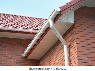 Close up view on House Problem Areas for Rain Gutter Waterproofing Outdoor. Home Guttering, Gutters, Plastic Guttering System, Guttering & Drainage Pipe Exterior