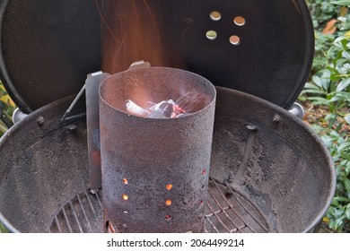 Close up view on rusty fireplace full of glowing, charcoal. preparing for grilling - Powered by Shutterstock