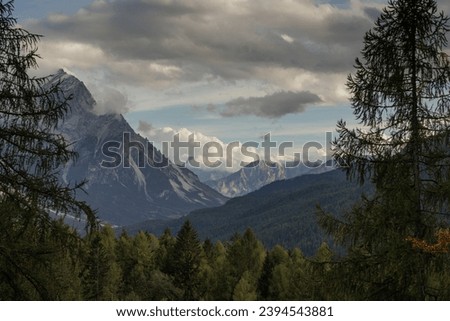 close up view on some mountains, valleys and forests in the Veneto Dolomites, in the district of Cortina d'Ampezzo, under a cloudy sky, in late afternoon, in autumn