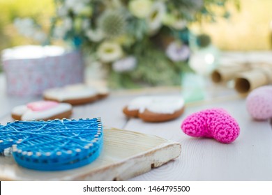 Close Up View On String Art And Crochet Heart Shaped Wedding Decor. Heart Shaped Cookies On A Stick