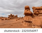 Close up view on unique eroded Hoodoo Rock Formations at Goblin Valley State Park in Utah, USA, America. Sandstone rocks called goblins which are mushroom-shaped rock pinnacles. Overcast day in summer