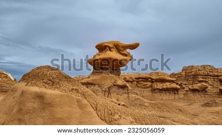 Close up view on unique eroded Hoodoo Rock Formations at Goblin Valley State Park in Utah, USA, America. Sandstone rocks called goblins which are mushroom-shaped rock pinnacles. Overcast day in summer