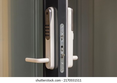 Close up view at open entrance door with modern white digital lock isolated.  - Shutterstock ID 2170551511