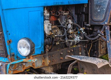 close view of opened diesel engine compartment of old belarussian farm tractor