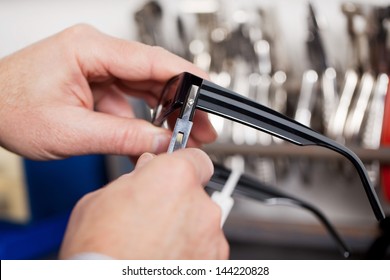 close up view of an optician fixing frame - Powered by Shutterstock