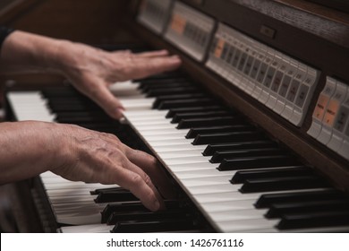 Close Up View Of A Organist Playing An Organ