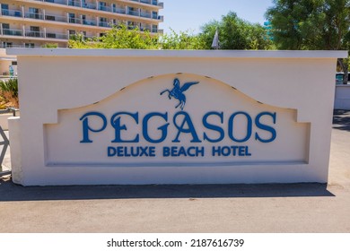 Close Up View Of Pegasos Deluxe Beach  Hotel Logo On Hotel Building Background. 
Greece. Rhodes. 07.15.2022