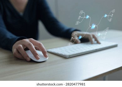 Close Up View Of Person Using Mouse And Keyboard At Desk For Data Management