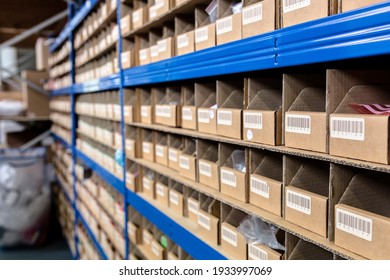 Up close view of pigeon holes used in a factory warehouse for storage of the raw materials. Warehouse, stores, storage, raw materials concept - Shutterstock ID 1933997069