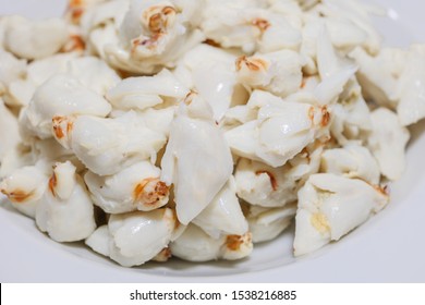 Close Up View Of Pile Of Fresh Steamed Crab Meat Without Shell And Ready To Eat On White Dish.