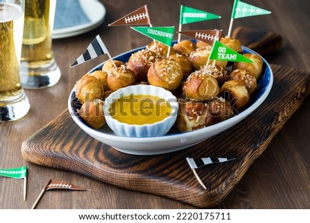 Close up view of a platter of pretzel bites ready for a Super Bowl celebration.