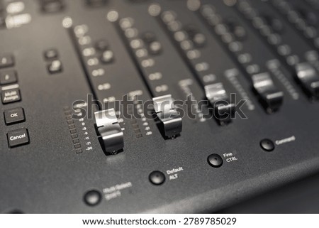 close up view of professional audio console mixing faders
