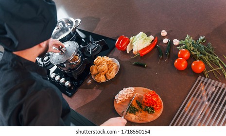 Close Up View Of Professional Young Chef Cook In Uniform That Working On The Kitchen.