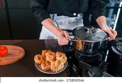 Close Up View Of Professional Young Chef Cook In Uniform That Working On The Kitchen.