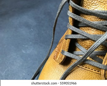 Close Up View Of Protective Leather Yellow Work Boot With Shoelaces Background Shoes Fashion Wallpaper Footwear Trends Surface