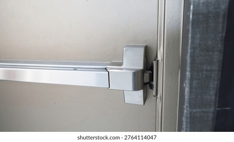A close up view of push bar .Fire exit door